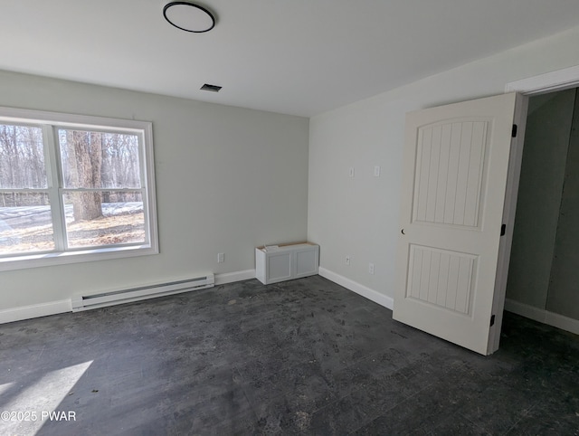 empty room featuring a baseboard radiator