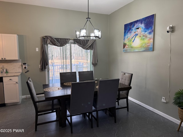 dining space featuring a notable chandelier