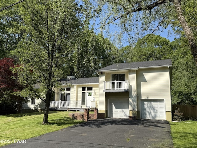 12044 Maplewood Dr, East Stroudsburg, PA 18302 - split level home with driveway, a garage, and a balcony