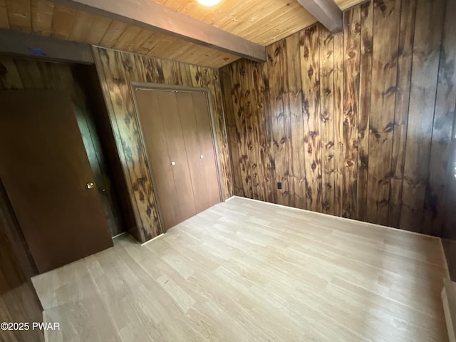 110 Parkwood Dr # 154, Lake Ariel, PA 18436 - unfurnished bedroom featuring wood walls, a wood ceiling with exposed beams, a closet, and wood finished floors