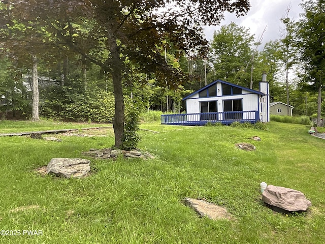 110 Parkwood Dr # 154, Lake Ariel, PA 18436 - view of grassy yard featuring a deck and view of scattered trees