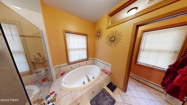 bathroom with tile patterned flooring, a wealth of natural light, independent shower and bath, and a baseboard radiator