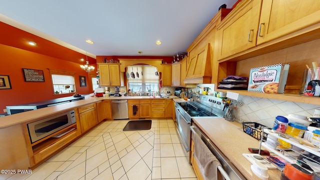 kitchen featuring an inviting chandelier, premium range hood, stainless steel appliances, tasteful backsplash, and pendant lighting