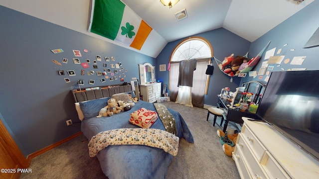 bedroom with lofted ceiling and carpet floors