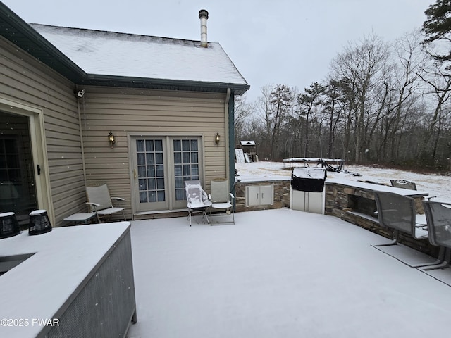 view of snow covered patio