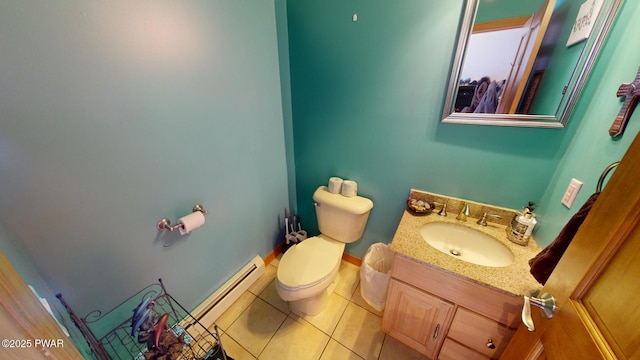 bathroom with toilet, vanity, tile patterned flooring, and a baseboard radiator