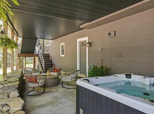 view of patio / terrace with a hot tub