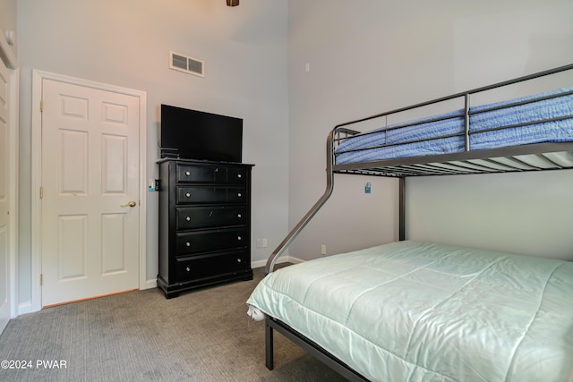 bedroom featuring light carpet