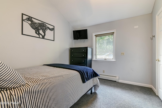 carpeted bedroom featuring vaulted ceiling and a baseboard heating unit