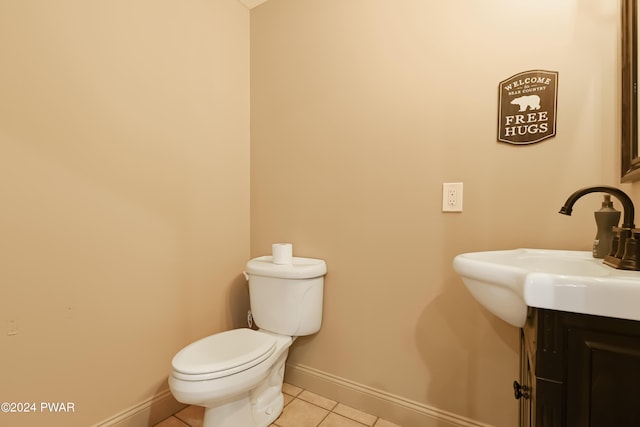 bathroom with tile patterned floors, vanity, and toilet