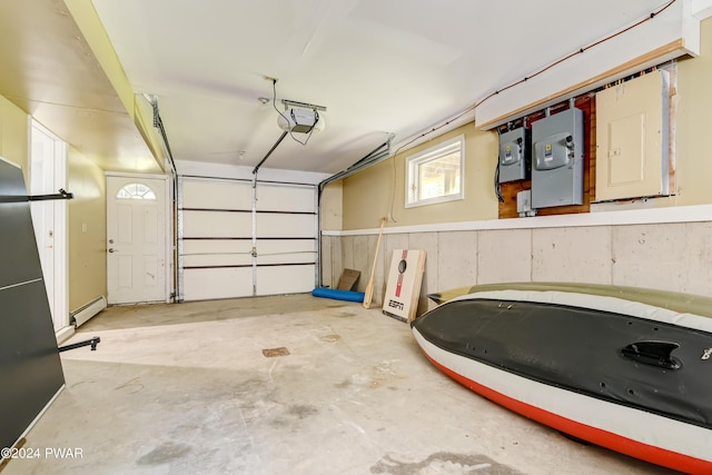 garage featuring electric panel, a baseboard radiator, and a garage door opener