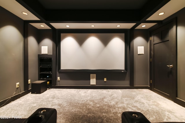 home theater featuring carpet, beam ceiling, and coffered ceiling