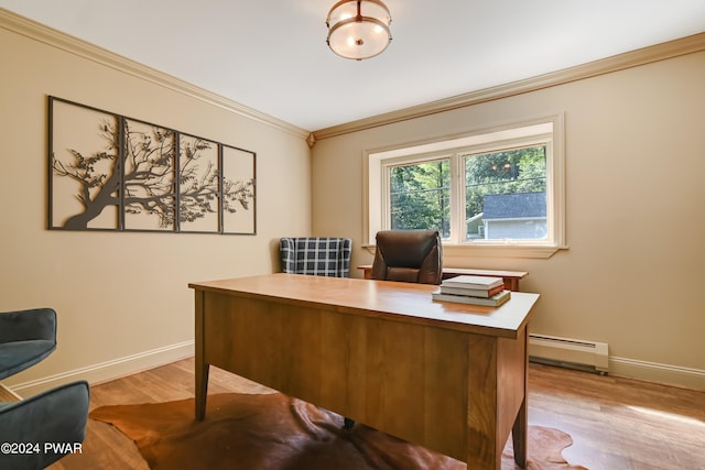 office space featuring light hardwood / wood-style flooring, crown molding, and a baseboard heating unit