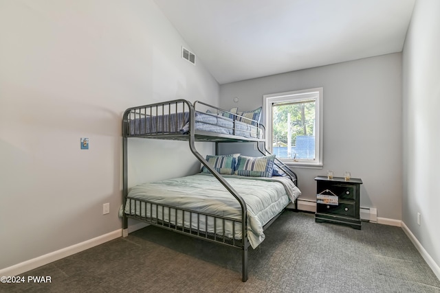 bedroom with baseboard heating, carpet floors, and lofted ceiling