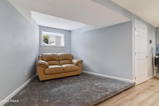 sitting room with hardwood / wood-style flooring