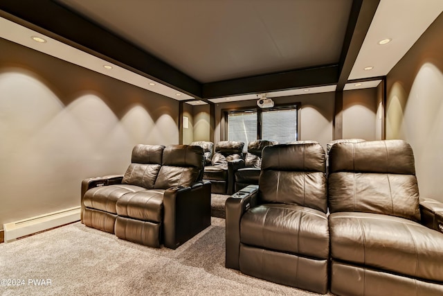 cinema room featuring light colored carpet and a baseboard heating unit