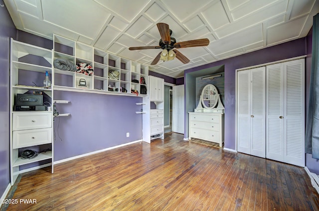 unfurnished bedroom featuring baseboards, a ceiling fan, and hardwood / wood-style flooring