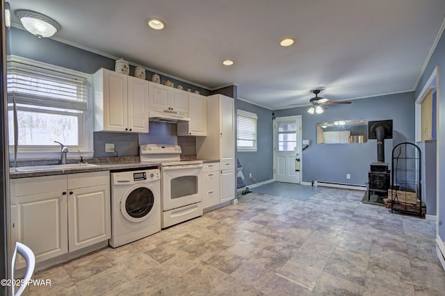 kitchen featuring under cabinet range hood, washer / clothes dryer, crown molding, and electric stove