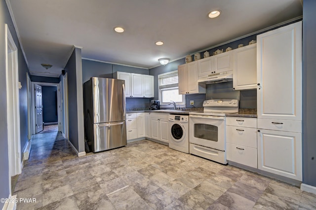 kitchen featuring white electric range oven, under cabinet range hood, freestanding refrigerator, dark countertops, and washer / dryer