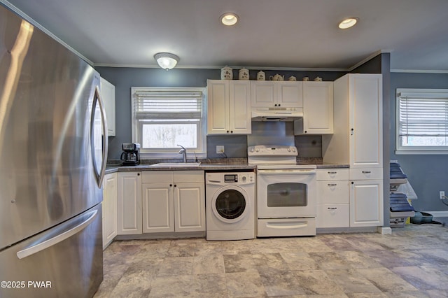 kitchen with a sink, washer / dryer, freestanding refrigerator, under cabinet range hood, and white range with electric stovetop