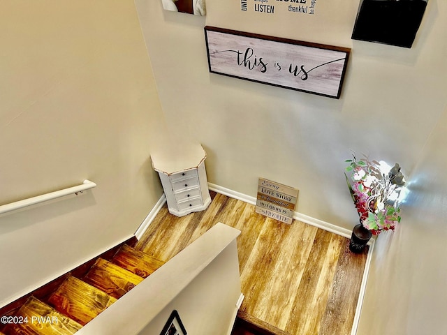 stairway featuring hardwood / wood-style floors