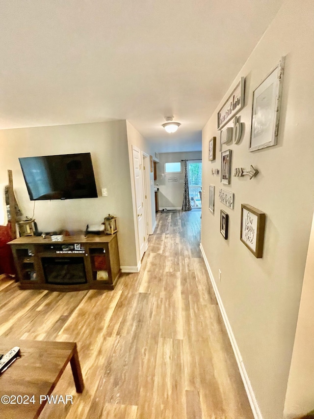 corridor featuring light hardwood / wood-style flooring