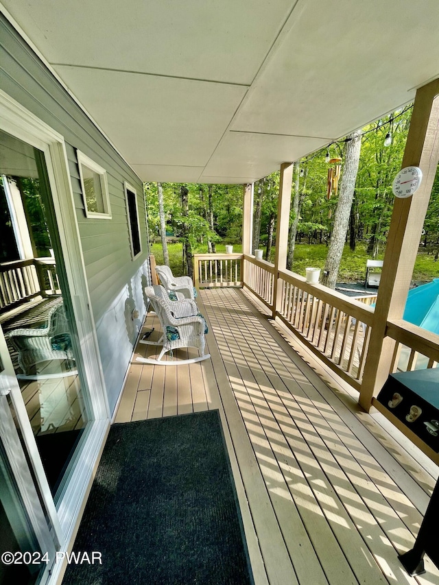 wooden terrace with a porch