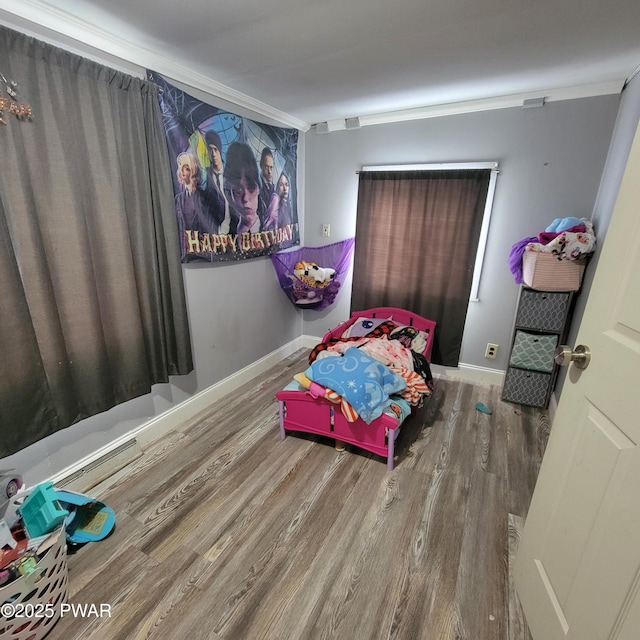 bedroom with wood-type flooring