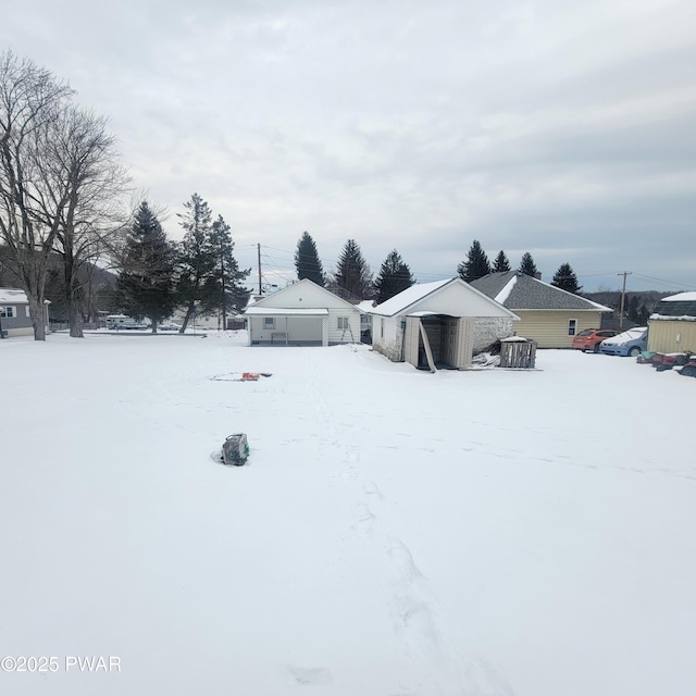 view of yard layered in snow