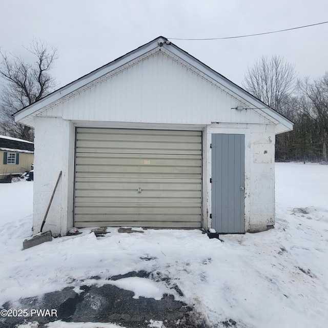 view of snow covered garage