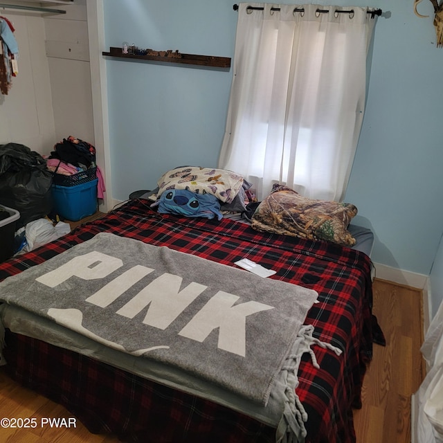 bedroom featuring hardwood / wood-style floors