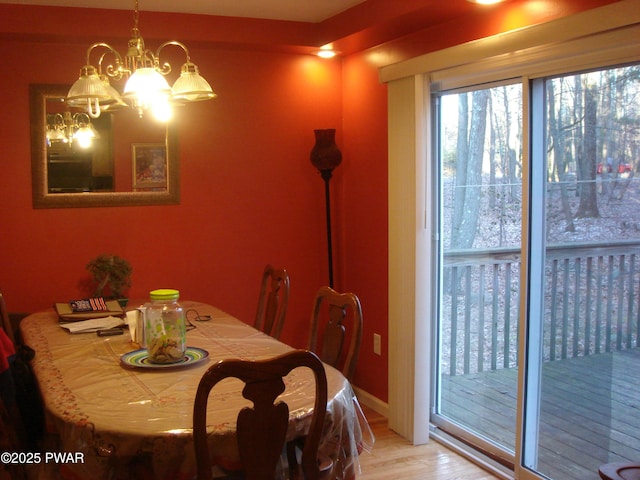 113 Oak Dr, Shohola, PA 18458 - dining area featuring a chandelier and wood finished floors