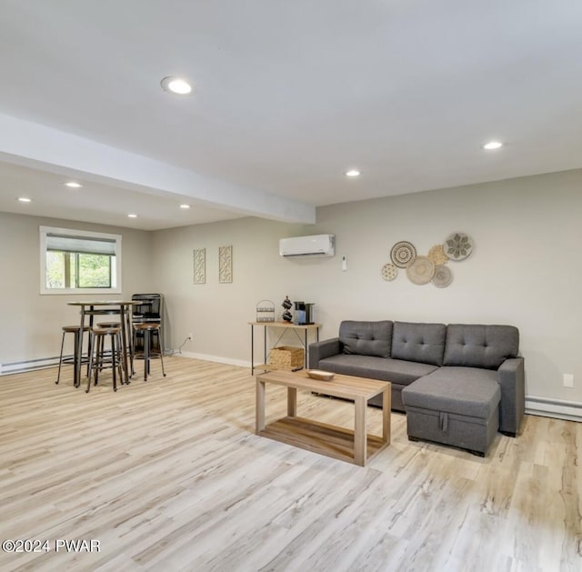 living room featuring baseboard heating, light hardwood / wood-style flooring, and a wall mounted AC