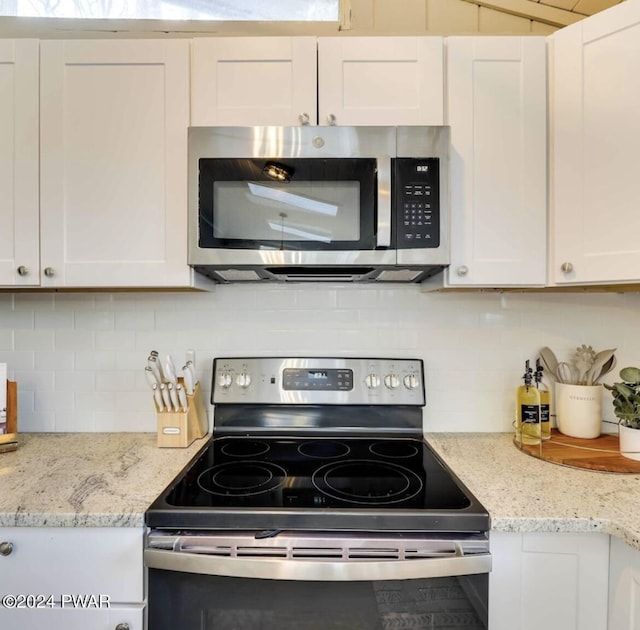 kitchen with white cabinets and stainless steel appliances