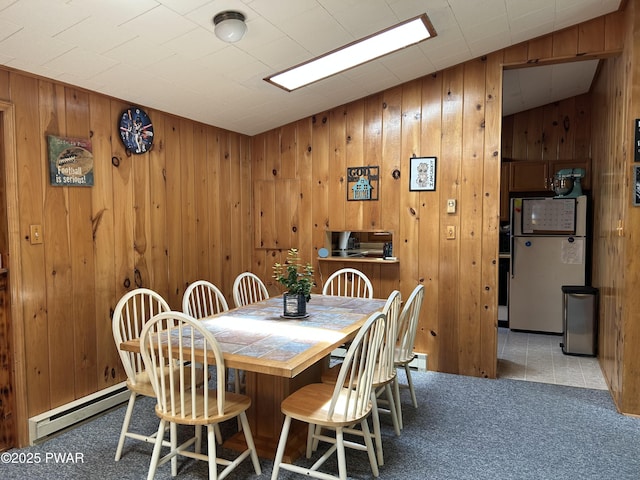 201 Oak Hill Rd, Hawley, PA 18428 - carpeted dining area featuring a baseboard heating unit and wood walls
