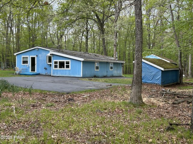 201 Oak Hill Rd, Hawley, PA 18428 - rear view of house with an outbuilding and a storage shed