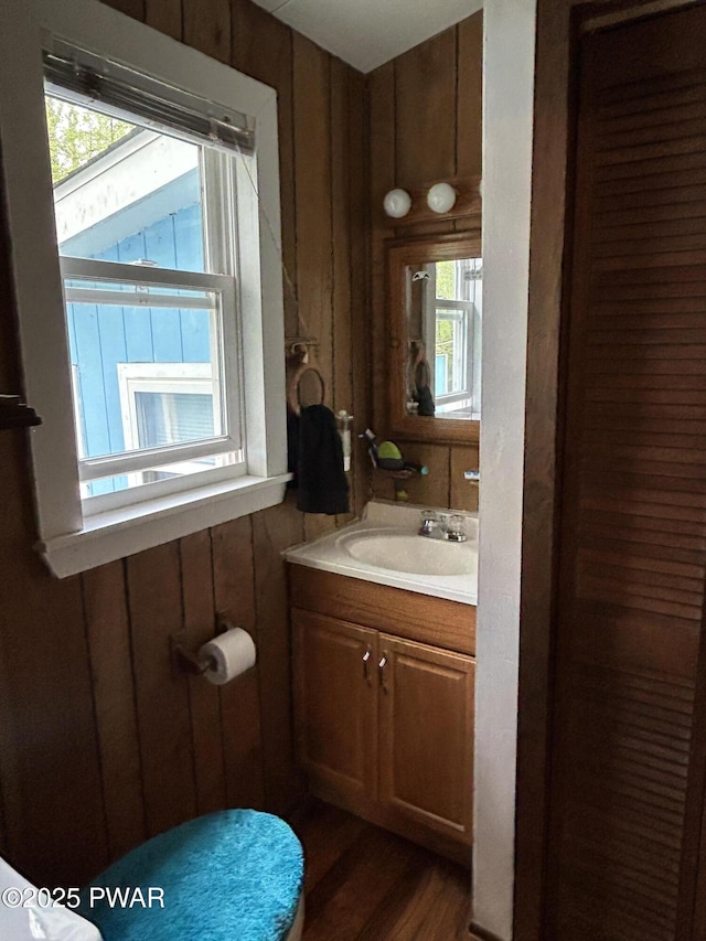 201 Oak Hill Rd, Hawley, PA 18428 - half bath with wood walls, wood finished floors, and vanity