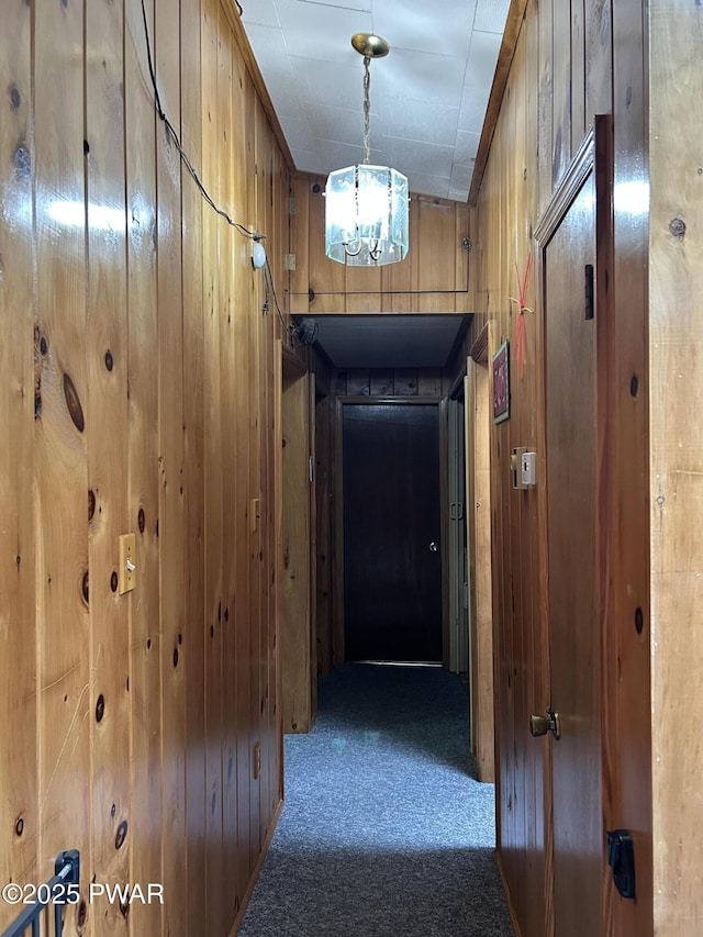201 Oak Hill Rd, Hawley, PA 18428 - corridor with carpet flooring, wood walls, and a chandelier