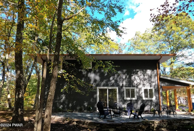 back of property featuring a patio