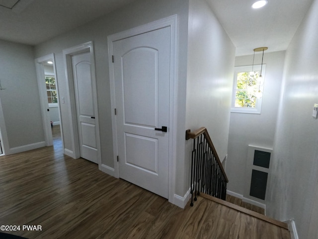 stairs featuring hardwood / wood-style floors