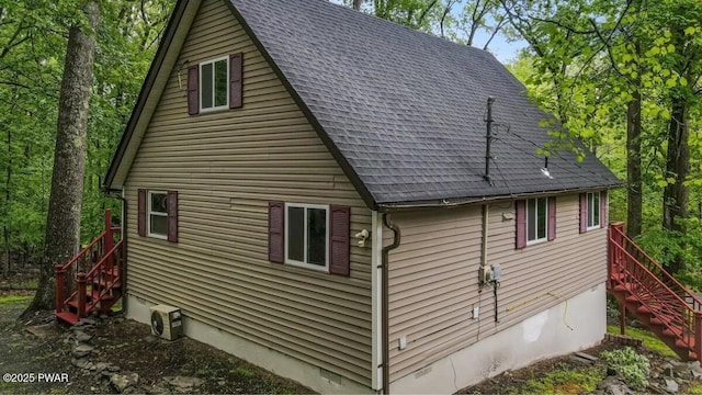 122 Westfall Dr, Dingmans Ferry, PA 18328 - view of side of property featuring stairway and a shingled roof