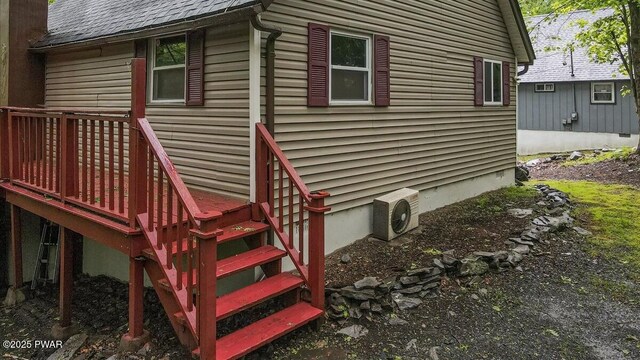 122 Westfall Dr, Dingmans Ferry, PA 18328 - view of property exterior with ac unit, a shingled roof, and a deck