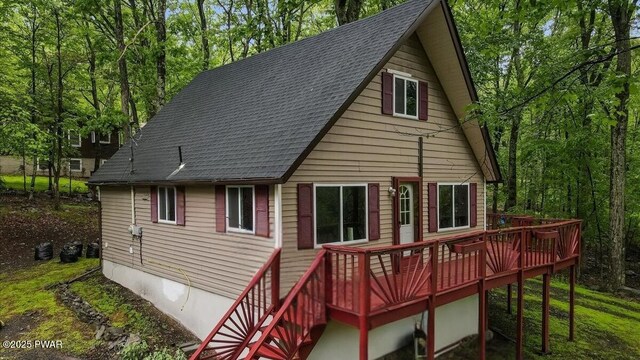 122 Westfall Dr, Dingmans Ferry, PA 18328 - back of property featuring roof with shingles and a deck