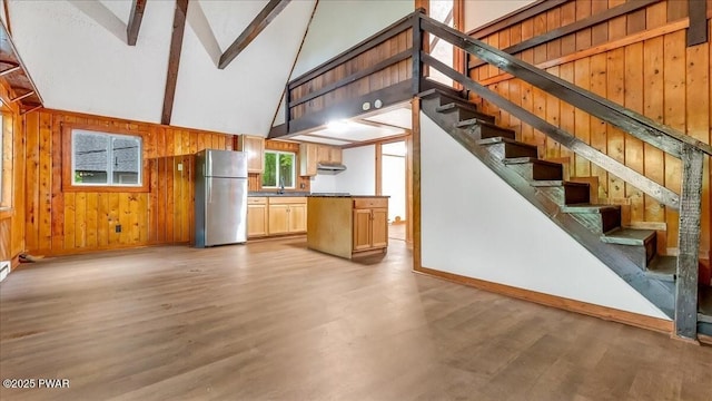 122 Westfall Dr, Dingmans Ferry, PA 18328 - unfurnished living room with wooden walls, beam ceiling, high vaulted ceiling, light wood finished floors, and baseboards