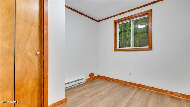 122 Westfall Dr, Dingmans Ferry, PA 18328 - unfurnished room with a baseboard heating unit, ornamental molding, wood finished floors, and baseboards