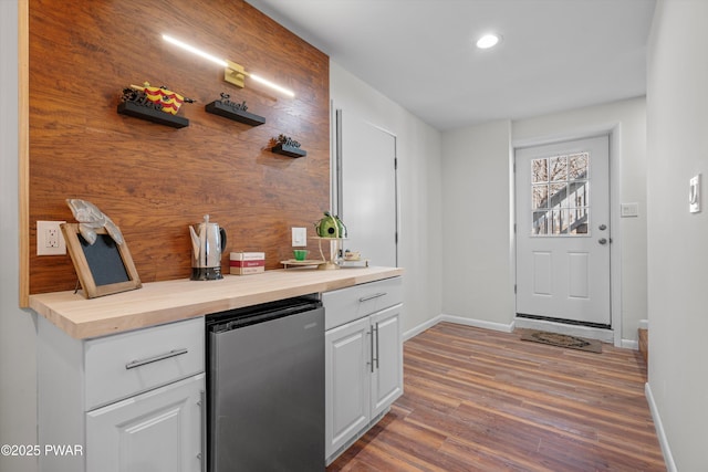 129 Remuda Dr, Lords Valley, PA 18428 - bar featuring freestanding refrigerator, recessed lighting, baseboards, and wood finished floors