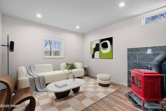 129 Remuda Dr, Lords Valley, PA 18428 - interior space featuring baseboards, a wood stove, recessed lighting, and wood finished floors