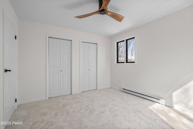 129 Remuda Dr, Lords Valley, PA 18428 - unfurnished bedroom featuring carpet floors, baseboards, two closets, and baseboard heating