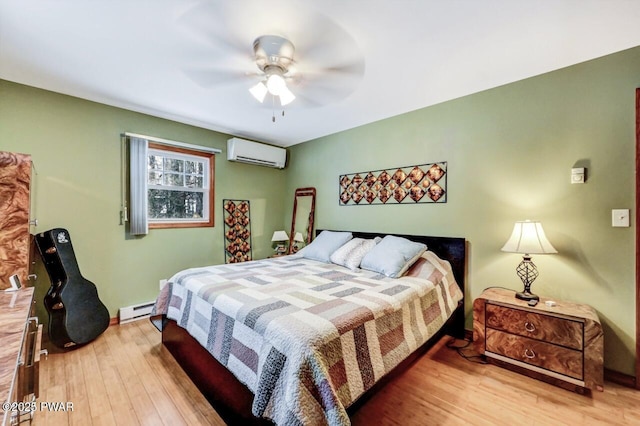 bedroom featuring ceiling fan, a baseboard radiator, an AC wall unit, and wood-type flooring