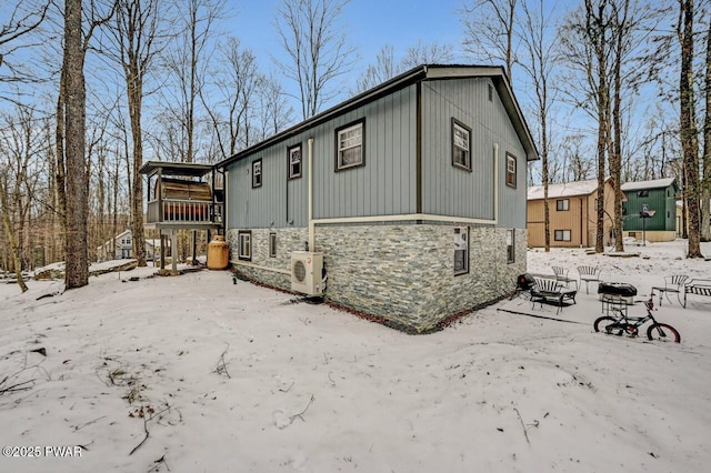 view of front of property featuring ac unit